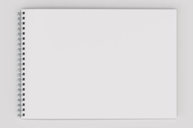 Beyaz arka plan üzerinde beyaz boş defter metal spiral ile bağlı