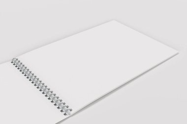 Açık boş beyaz defter ile metal sarmal üzerinde beyaz backg bağlı
