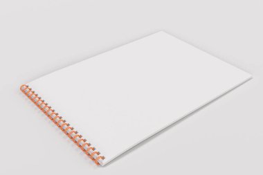 Beyaz arka plan üzerinde beyaz boş defter metal spiral ile bağlı