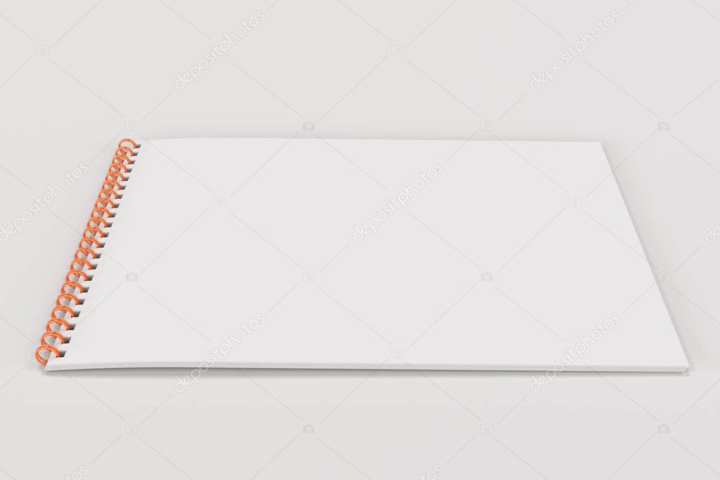 Blank white notebook with metal spiral bound on white background