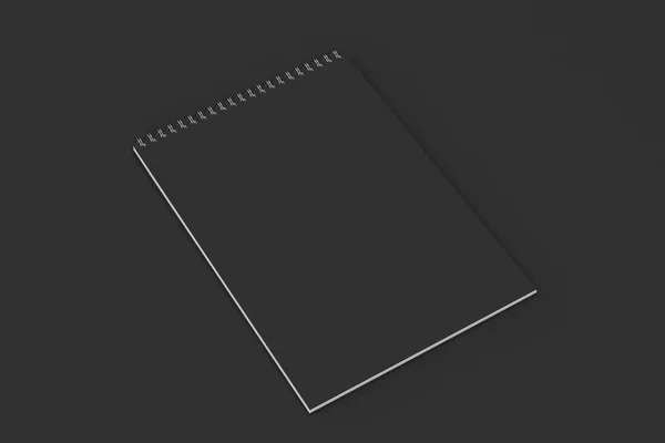 Caderno preto em branco com espiral de metal encadernado em fundo preto — Fotografia de Stock