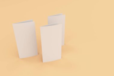 Boş beyaz iki kat broşürü mockup turuncu zemin üzerine