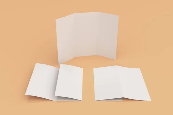 Branco em branco três vezes brochura mockup no fundo laranja — Fotografia de Stock