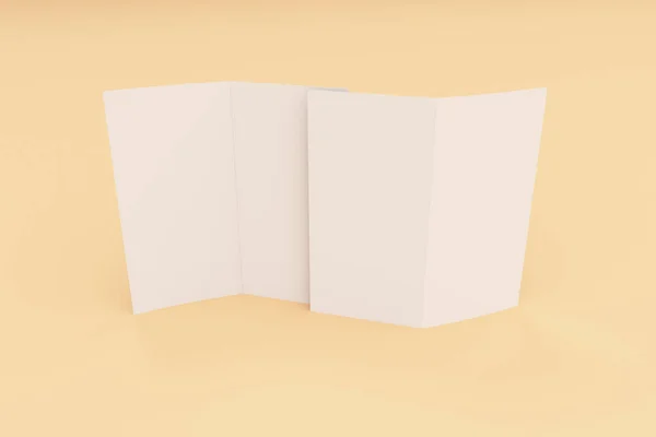 Lege witte twee vouwen brochure mockup op oranje achtergrond — Stockfoto