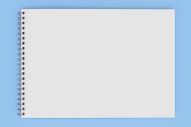Üzerinde mavi arka plan beyaz boş defter metal spiral ile bağlı