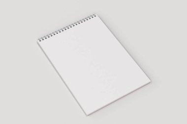 Beyaz arka plan üzerinde beyaz boş defter metal spiral ile bağlı