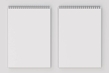 Beyaz arka plan üzerinde beyaz boş defter metal spiral ile bağlı