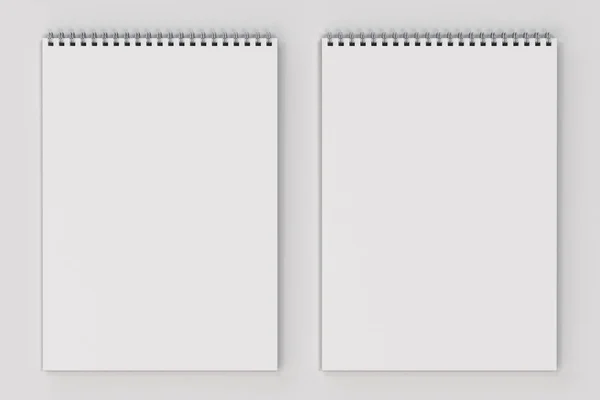 Порожній білий блокнот з металевою спіраллю, прив'язаною на білому тлі — стокове фото