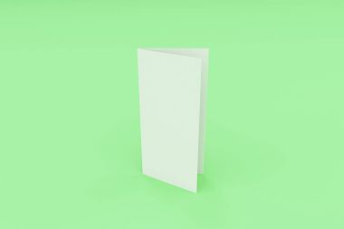 Boş beyaz üç katlı broşür mockup yeşil adam üzerinde kapalı