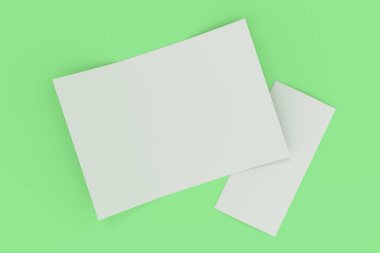Yeşil zemin üzerine boş beyaz açık üç katlı broşür mockup