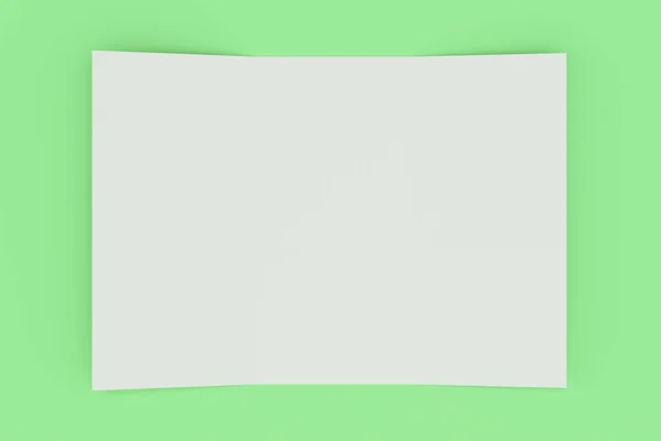 Üres fehér nyitott háromszorosa brosúra makett zöld háttér — Stock Fotó