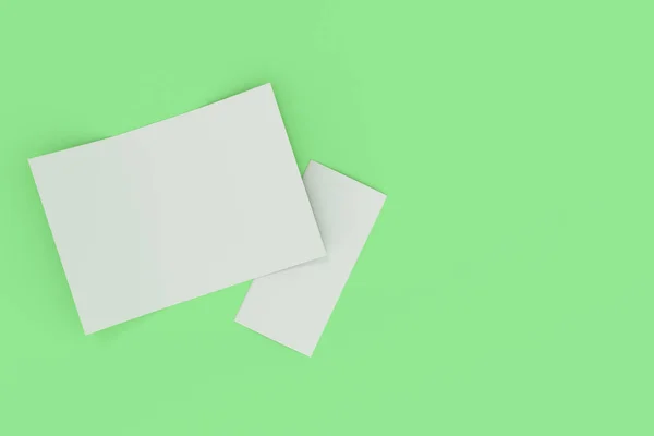 Lege witte open drie vouwen brochure mockup op groene achtergrond — Stockfoto