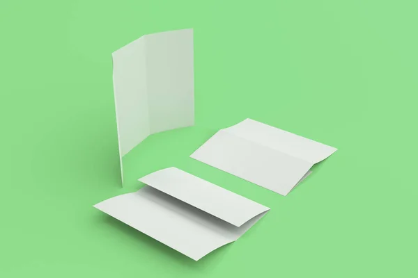 Folleto de tres pliegues blanco en blanco maqueta sobre fondo verde —  Fotos de Stock