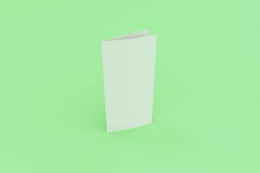 Boş beyaz iki kat broşürü mockup yeşil zemin üzerine