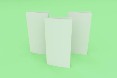 Boş beyaz iki kat broşürü mockup yeşil zemin üzerine