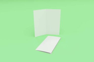 Boş beyaz iki kat broşürü mockup yeşil zemin üzerine