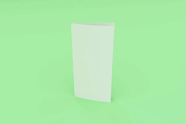 Folleto blanco en blanco de dos pliegues maqueta sobre fondo verde — Foto de Stock