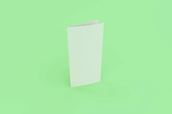 Folleto blanco en blanco de dos pliegues maqueta sobre fondo verde — Foto de Stock