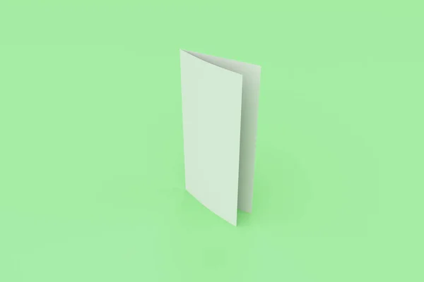 Lege witte twee vouwen brochure mockup op groene achtergrond — Stockfoto