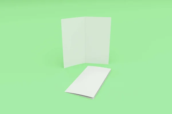Blank vit två gånger broschyr mockup på grön bakgrund — Stockfoto