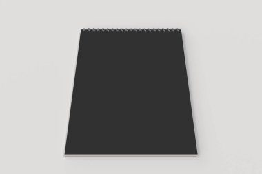 Beyaz zemin üzerine boş siyah defter metal spiral ile bağlı