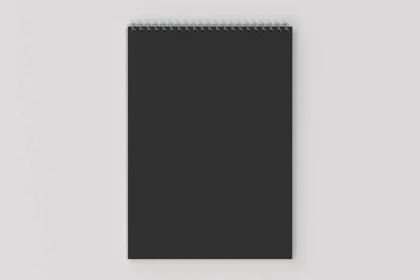 Cuaderno negro en blanco con espiral metálica encuadernada sobre fondo blanco — Foto de Stock