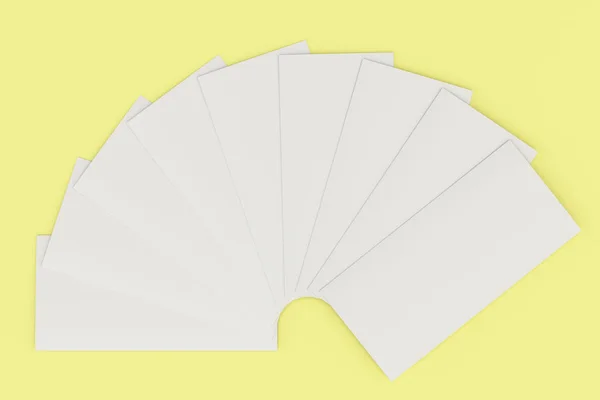 Folleto de tres pliegues blanco en blanco maqueta sobre fondo amarillo —  Fotos de Stock