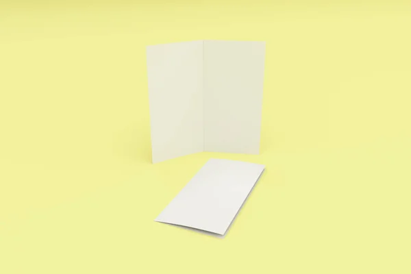黄色の背景の空白の白 2 つ折りパンフレット モックアップ — ストック写真