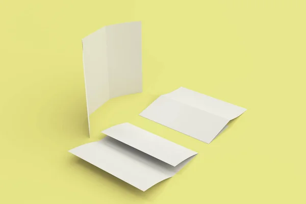 Folleto de tres pliegues blanco en blanco maqueta sobre fondo amarillo —  Fotos de Stock