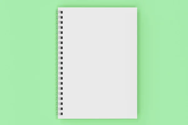 Caderno fechado espiral encadernado no fundo verde — Fotografia de Stock
