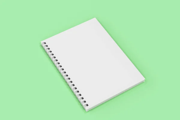 Chiuso notebook spirale rilegato su sfondo verde — Foto Stock