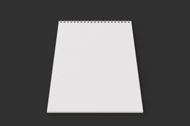 Boş beyaz defter ile metal sarmal siyah arka plan üzerine bağlı