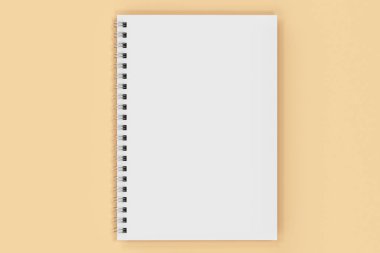 Turuncu zemin üzerine bağlı kapalı defter spiral