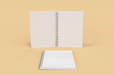 Turuncu zemin üzerine iki defter spiral ile bağlı