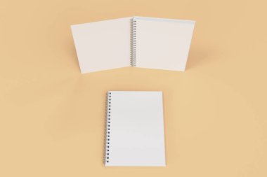 Turuncu zemin üzerine iki defter spiral ile bağlı