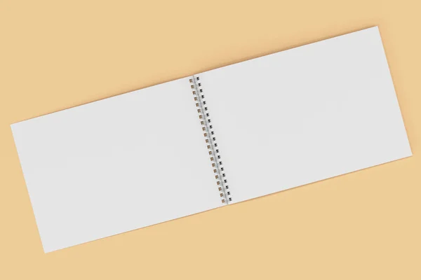 Lege witte notitieblok openen met metalen spiraal gebonden op oranje terug — Stockfoto