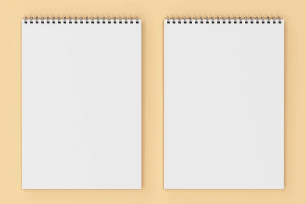 Caderno branco em branco com espiral de metal encadernado no fundo laranja — Fotografia de Stock