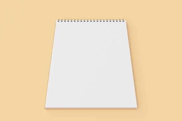 Caderno branco em branco com espiral de metal encadernado no fundo laranja — Fotografia de Stock