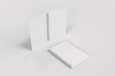 Beyaz arka plan üzerinde iki defter spiral ile bağlı