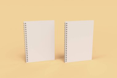 Turuncu zemin üzerine iki defter spiral ile bağlı