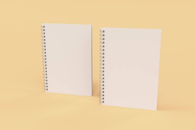 Turuncu zemin üzerine iki defter spiral ile bağlı