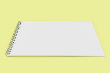 Boş beyaz defter ile metal sarmal sarı adam bağlı