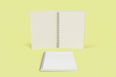 Sarı arka plan üzerinde iki defter spiral ile bağlı