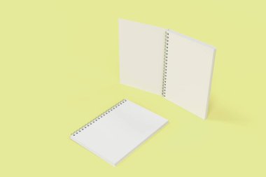 Sarı arka plan üzerinde iki defter spiral ile bağlı