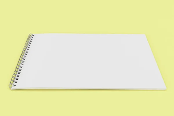 空白与金属螺旋装订在黄色背景上的白色笔记本 — 图库照片