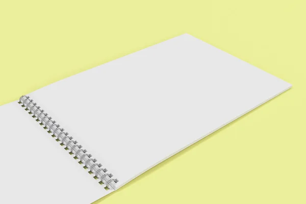 Caderno branco em branco aberto com espiral de metal encadernado nas costas amarelas — Fotografia de Stock