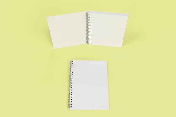 Két jegyzetfüzet, spirál kötött a sárga háttér — Stock Fotó