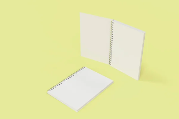 Dos cuadernos con espiral encuadernada sobre fondo amarillo —  Fotos de Stock