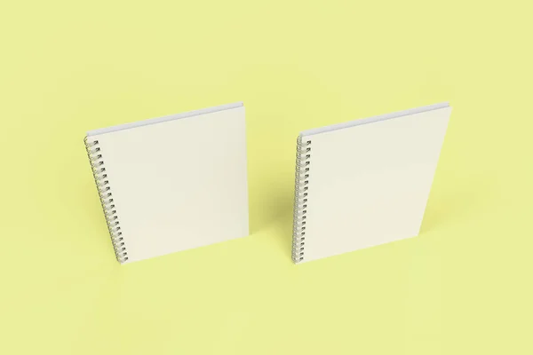 Dos cuadernos con espiral encuadernada sobre fondo amarillo — Foto de Stock