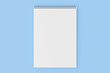 Üzerinde mavi arka plan beyaz boş defter metal spiral ile bağlı